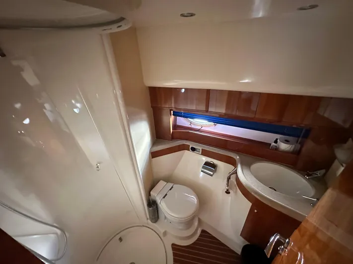  Yacht Photos Pics Luxurious bathroom in 2003 Aicon 56 Flybridge yacht with modern amenities.