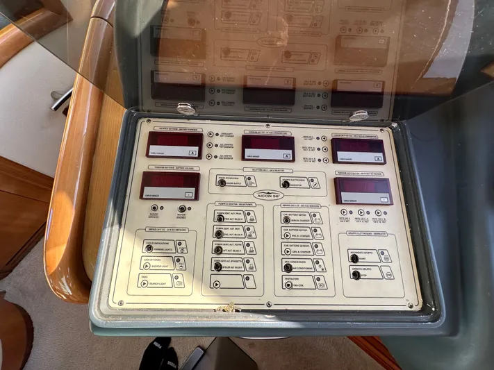  Yacht Photos Pics Control panel of 2003 Aicon 56 Flybridge yacht with various switches and displays.