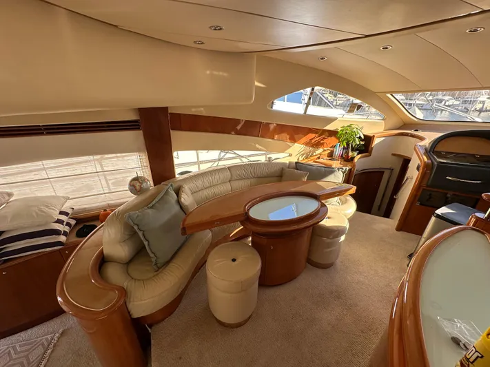  Yacht Photos Pics Luxurious interior of 2003 Aicon 56 Flybridge yacht with elegant seating and decor.