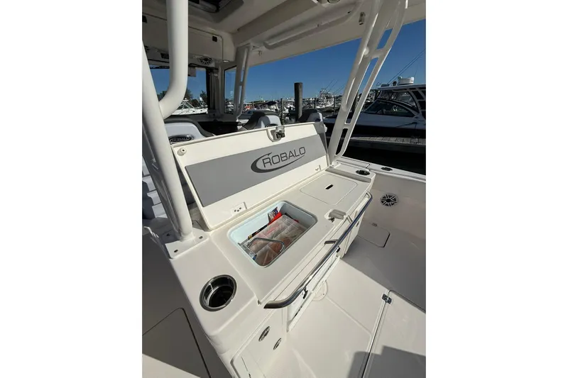  Yacht Photos Pics 2025 Robalo R300 Center Console boat interior with storage compartment open.