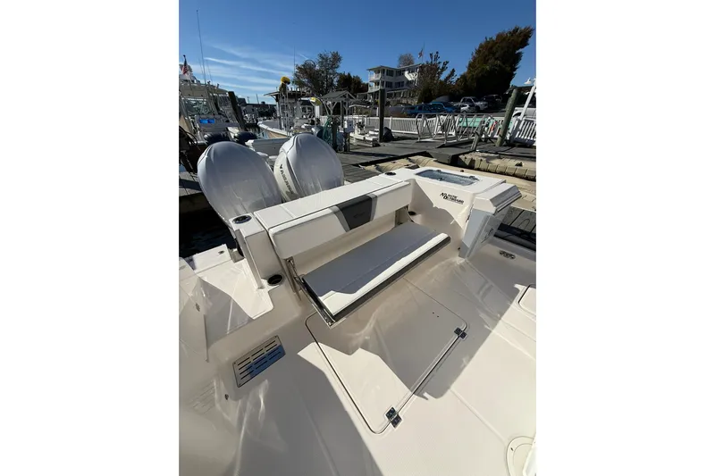  Yacht Photos Pics 2025 Robalo R300 Center Console boat with dual engines at a marina dock.