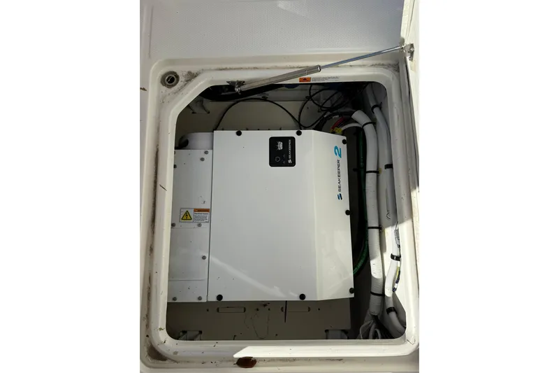  Yacht Photos Pics 2025 Robalo R300 Center Console engine compartment with Seakeeper 2 stabilization system.