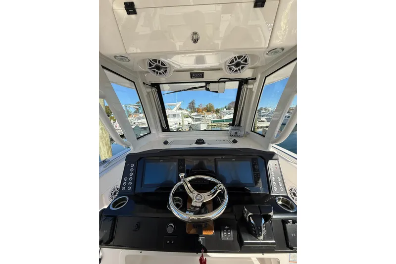  Yacht Photos Pics 2025 Robalo R300 Center Console boat dashboard with modern controls and navigation screens.