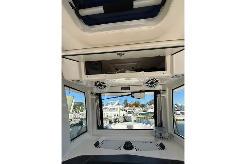  Yacht Photos Pics 2025 Robalo R300 Center Console interior with speakers and navigation equipment.