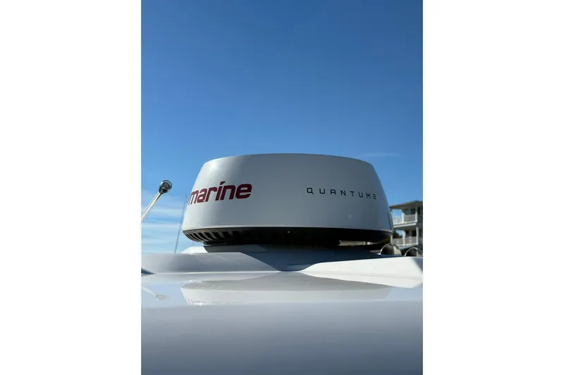  Yacht Photos Pics Radar system on 2025 Robalo R300 Center Console boat under clear blue sky.
