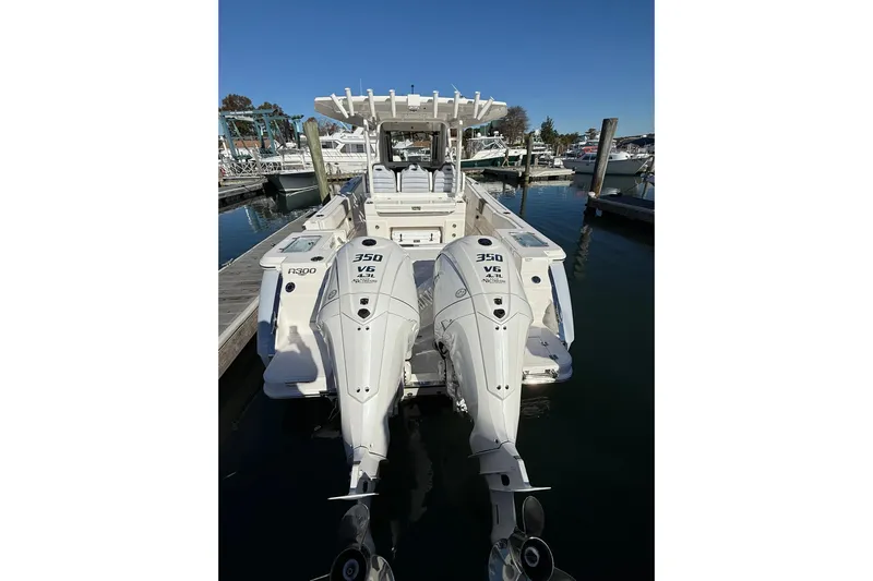  Yacht Photos Pics 2025 Robalo R300 Center Console boat with twin 350 V6 engines docked at marina.