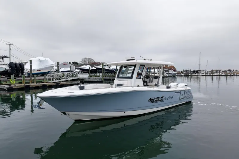  Yacht Photos Pics 2025 Robalo R300 Center Console boat docked in a marina.