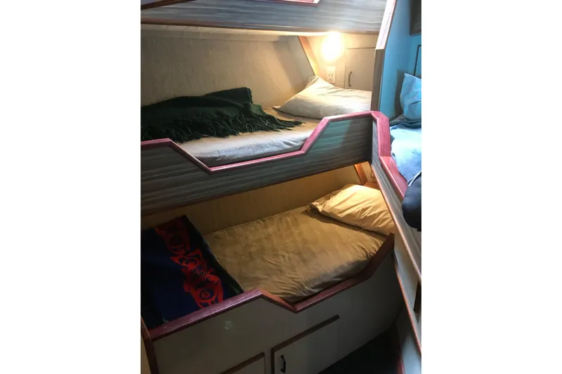  Yacht Photos Pics Bunk beds in 1973 Custom 58&rsquo; Steel Marco Seiner, cozy cabin interior.