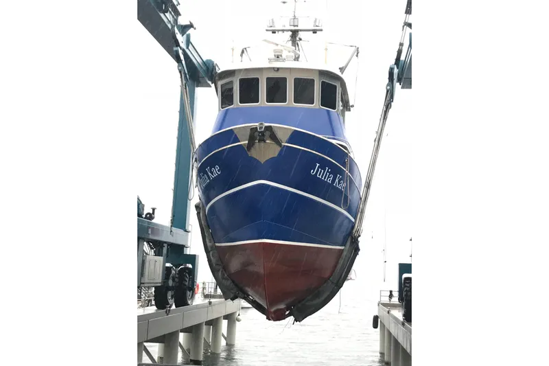  Yacht Photos Pics 1973 Custom 58&rsquo; Steel Marco Seiner boat in dry dock, blue hull visible.