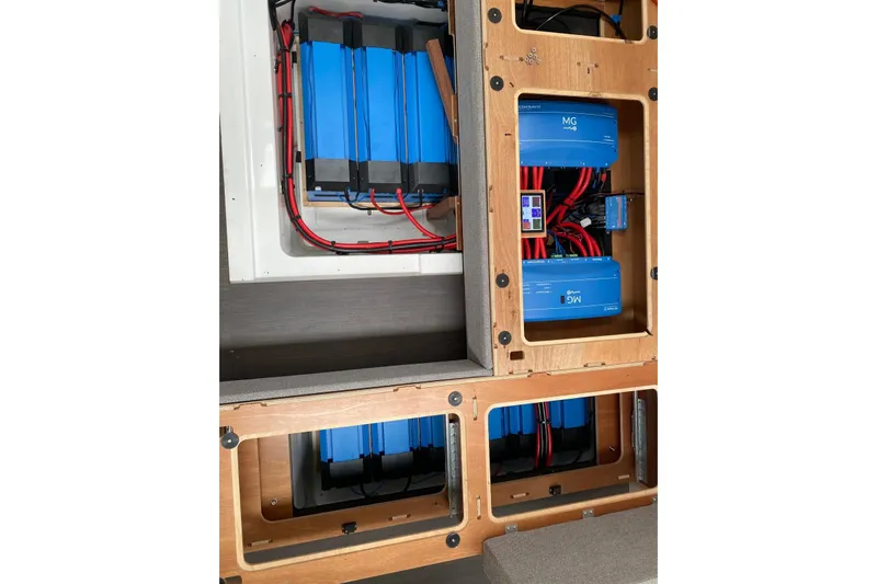  Yacht Photos Pics Electrical system of 2023 Lagoon 55 yacht, featuring blue battery units and wiring.