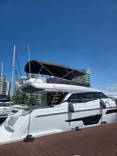 Ferretti Yachts 500 Yacht Photos Pics 2022 Ferretti Yachts 500 docked under clear blue sky.