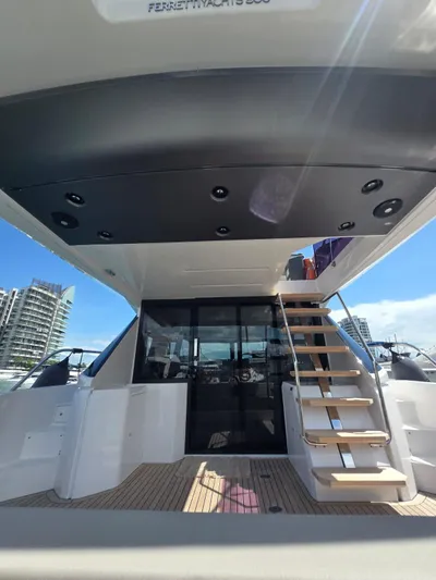 Ferretti Yachts 500 Yacht Photos Pics 2022 Ferretti Yachts 500, rear view with stairs and modern design elements.