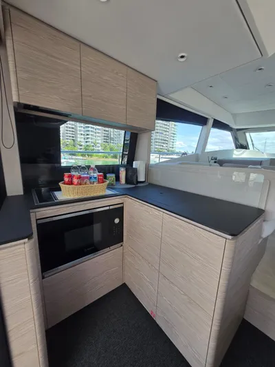 Ferretti Yachts 500 Yacht Photos Pics Modern kitchen interior of 2022 Ferretti Yachts 500 with sleek cabinetry and appliances.
