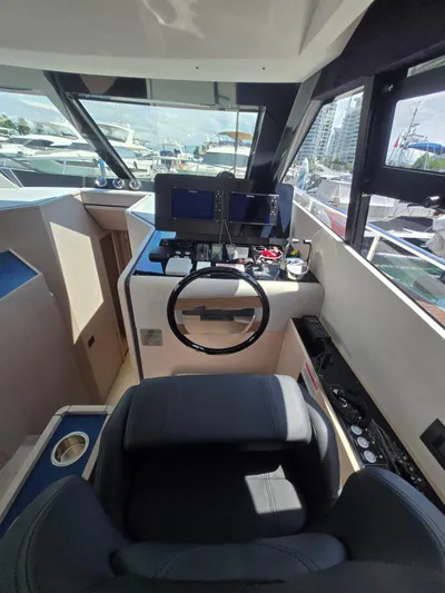 Ferretti Yachts 500 Yacht Photos Pics Interior helm of 2022 Ferretti Yachts 500, featuring modern navigation equipment and luxurious seating.