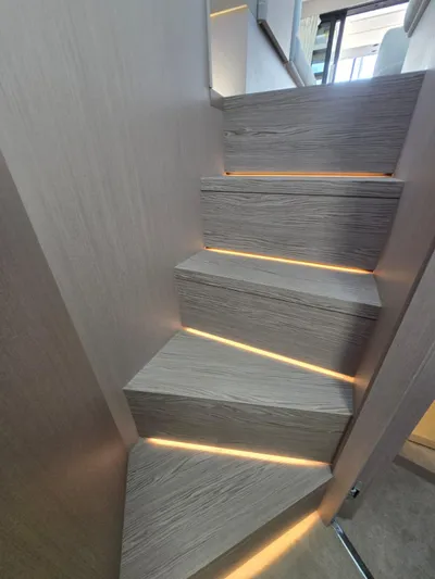 Ferretti Yachts 500 Yacht Photos Pics Modern staircase with ambient lighting on a 2022 Ferretti Yachts 500.