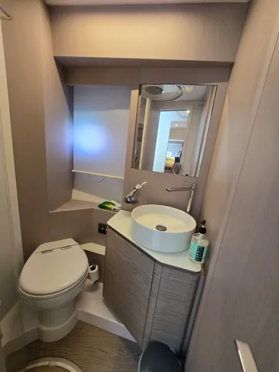 Ferretti Yachts 500 Yacht Photos Pics Modern bathroom in 2022 Ferretti Yachts 500, featuring sleek design and compact amenities.