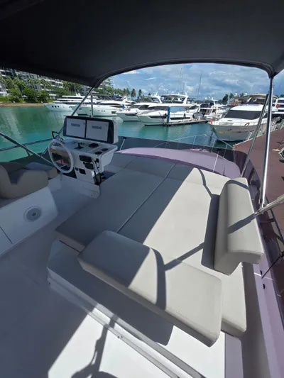 Ferretti Yachts 500 Yacht Photos Pics 2022 Ferretti Yachts 500, luxury yacht interior with helm, docked in marina.