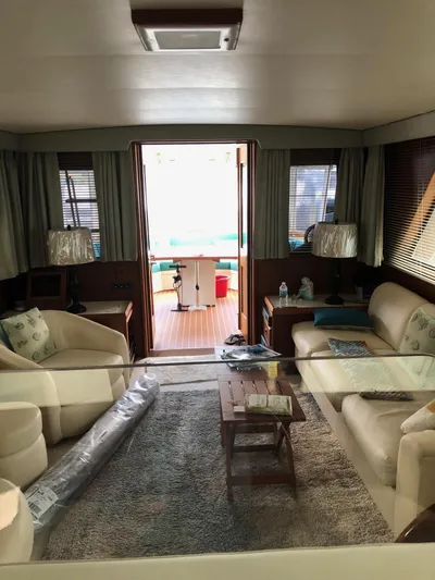  Yacht Photos Pics Interior of 1980 Hatteras 53 Motor Yacht, featuring cozy seating and elegant decor.