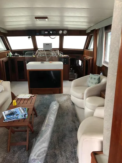  Yacht Photos Pics Interior of 1980 Hatteras 53 Motor Yacht with cozy seating and helm station.