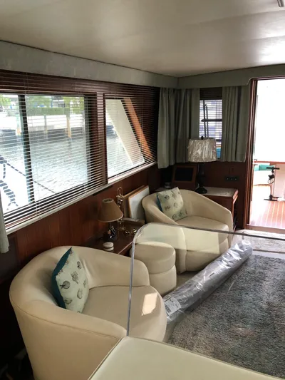  Yacht Photos Pics Interior of 1980 Hatteras 53 Motor Yacht with cozy seating and elegant decor.