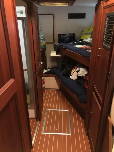  Yacht Photos Pics Interior of 1980 Hatteras 53 Motor Yacht with wooden flooring and bunk beds.