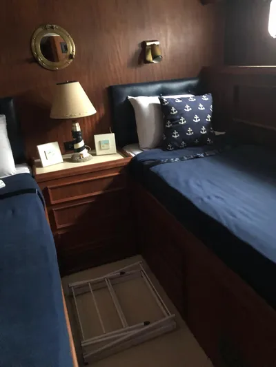  Yacht Photos Pics Cozy cabin interior of 1980 Hatteras 53 Motor Yacht with nautical-themed decor.