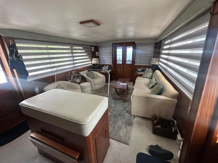  Yacht Photos Pics Interior of 1980 Hatteras 53 Motoryacht, featuring cozy seating and elegant decor.