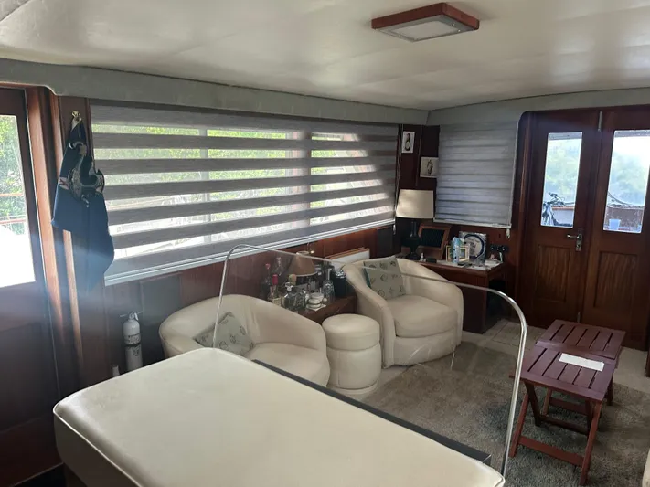  Yacht Photos Pics Luxurious interior of a 1980 Hatteras 53 Motoryacht with elegant seating and decor.