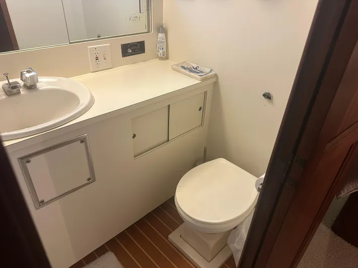  Yacht Photos Pics Bathroom interior of 1980 Hatteras 53 Motoryacht with sink and toilet.