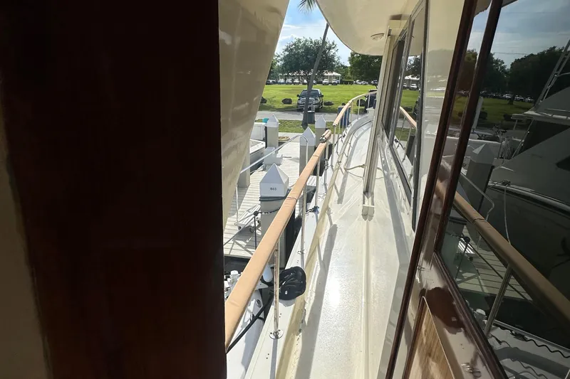  Yacht Photos Pics 1980 Hatteras 53 Motoryacht deck view with railing and dockside perspective.
