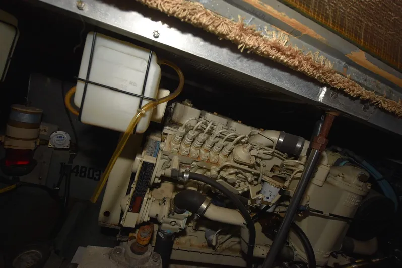 Miss Dot Yacht Photos Pics Engine compartment of a 1997 Carver 405 Aft Cabin Motoryacht, showcasing mechanical components.