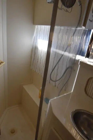 Miss Dot Yacht Photos Pics Bathroom interior of 1997 Carver 405 Aft Cabin Motoryacht with shower and sink.
