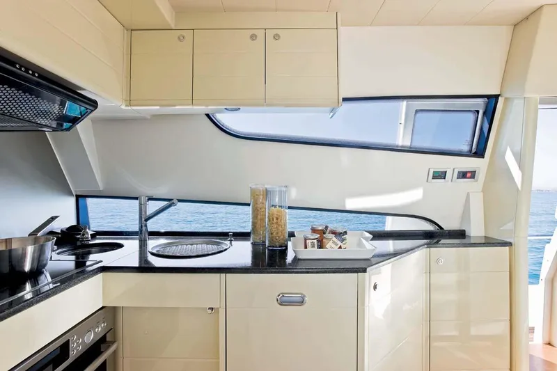  Yacht Photos Pics Luxurious kitchen interior of 2009 Ferretti Yachts 681 with ocean view.