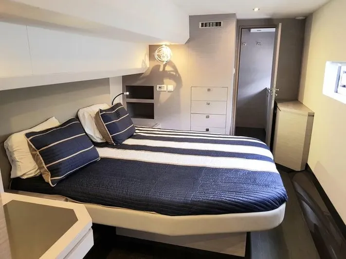Calypso Yacht Photos Pics Luxurious bedroom interior of 2021 Fountaine Pajot MY6 yacht with modern design.