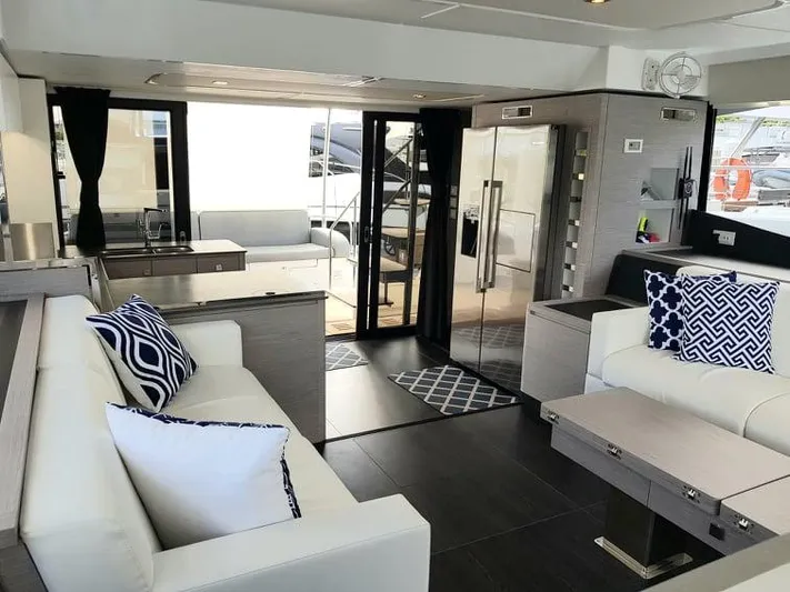 Calypso Yacht Photos Pics Luxurious interior of 2021 Fountaine Pajot MY6 yacht with modern furnishings and elegant decor.
