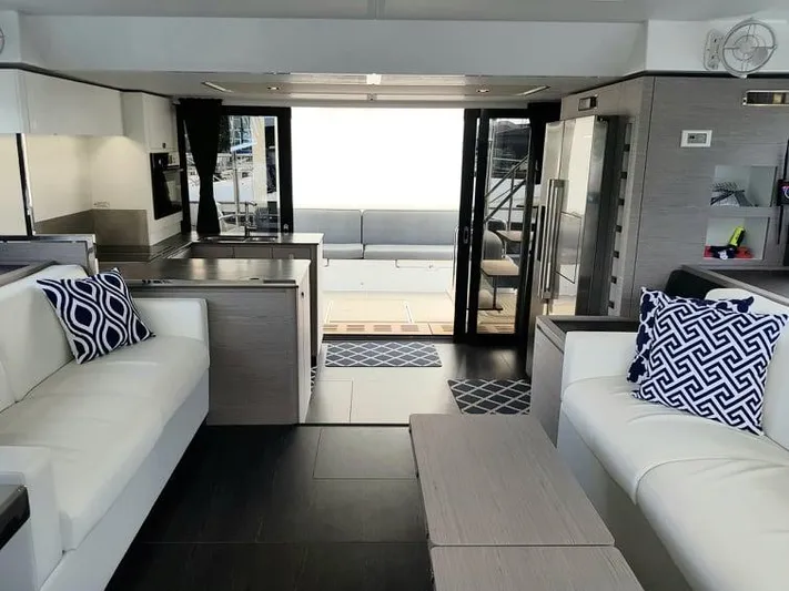 Calypso Yacht Photos Pics Luxurious interior of 2021 Fountaine Pajot MY6 yacht with modern furnishings and elegant design.