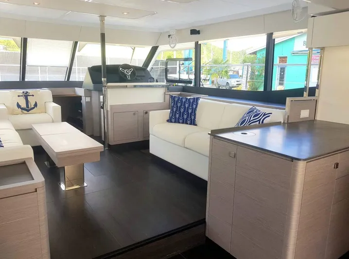 Calypso Yacht Photos Pics Luxurious interior of 2021 Fountaine Pajot MY6 yacht with modern furnishings and decor.