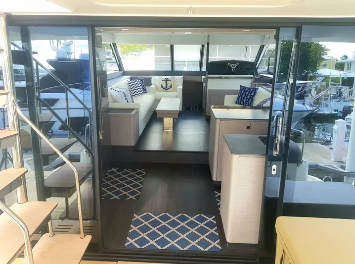 Calypso Yacht Photos Pics Luxurious interior of 2021 Fountaine Pajot MY6 yacht with modern seating and nautical decor.