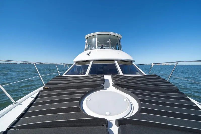 Cape San Blas Inn Yacht Photos Pics 1998 Carver 455 Aft Cabin Motor Yacht on open water, sunny day, clear sky.
