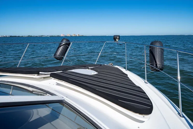 Cape San Blas Inn Yacht Photos Pics 1998 Carver 455 Aft Cabin Motor Yacht on open water, sunny day, clear blue sky.