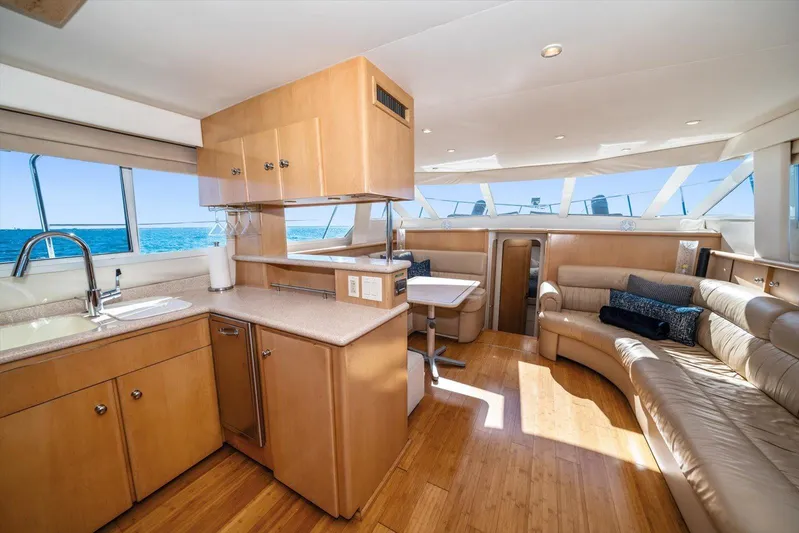 Cape San Blas Inn Yacht Photos Pics Luxurious interior of 1998 Carver 455 Aft Cabin Motor Yacht with modern kitchen and seating.
