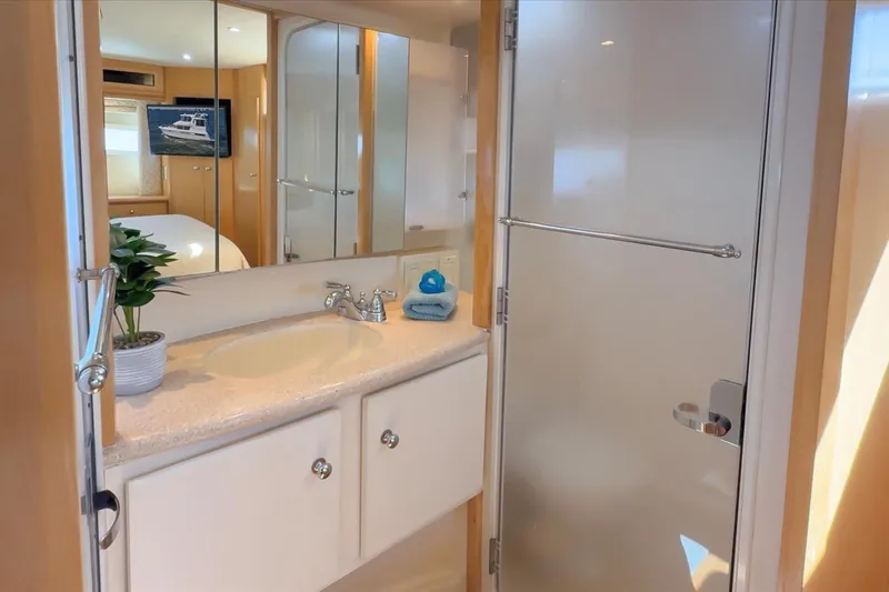 Cape San Blas Inn Yacht Photos Pics Bathroom interior of 1998 Carver 455 Aft Cabin Motor Yacht with sink and shower.