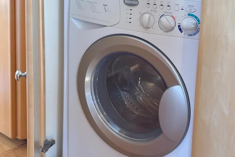 Cape San Blas Inn Yacht Photos Pics Washing machine inside 1998 Carver 455 Aft Cabin Motor Yacht laundry area.