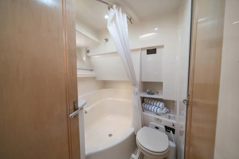 Cape San Blas Inn Yacht Photos Pics Bathroom interior of 1998 Carver 455 Aft Cabin Motor Yacht, featuring shower and toilet.