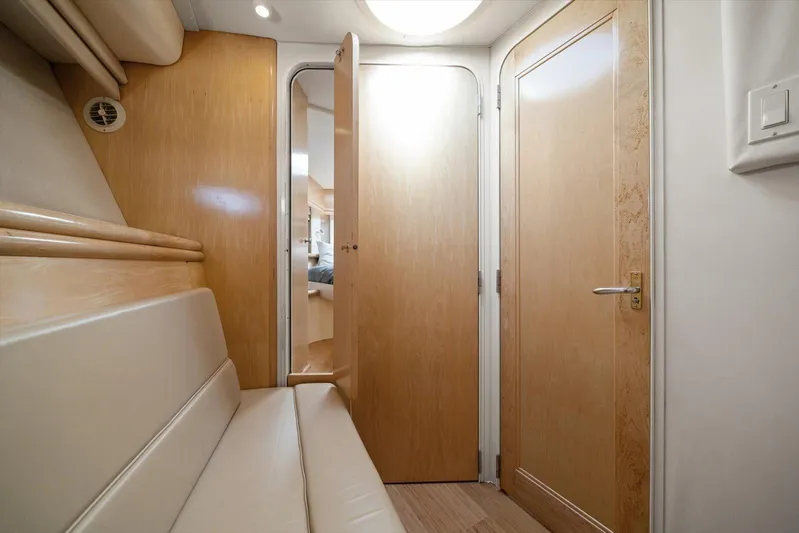 Cape San Blas Inn Yacht Photos Pics Interior of 1998 Carver 455 Aft Cabin Motor Yacht with wooden doors and seating.