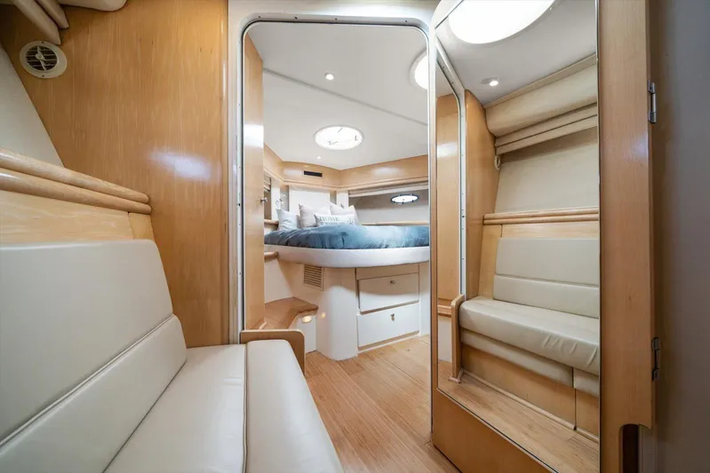 Cape San Blas Inn Yacht Photos Pics Interior of 1998 Carver 455 Aft Cabin Motor Yacht, featuring cozy seating and elegant wood finishes.