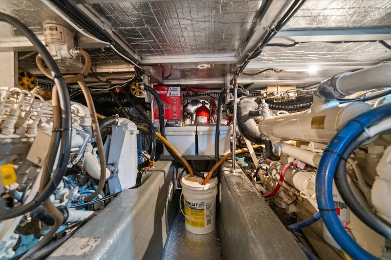 Cape San Blas Inn Yacht Photos Pics Engine room of 1998 Carver 455 Aft Cabin Motor Yacht, showcasing mechanical components.