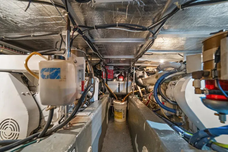 Cape San Blas Inn Yacht Photos Pics Engine room of 1998 Carver 455 Aft Cabin Motor Yacht, showcasing mechanical components.