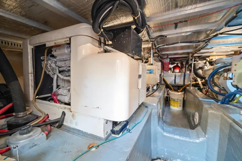 Cape San Blas Inn Yacht Photos Pics Engine room of 1998 Carver 455 Aft Cabin Motor Yacht, showcasing mechanical components.