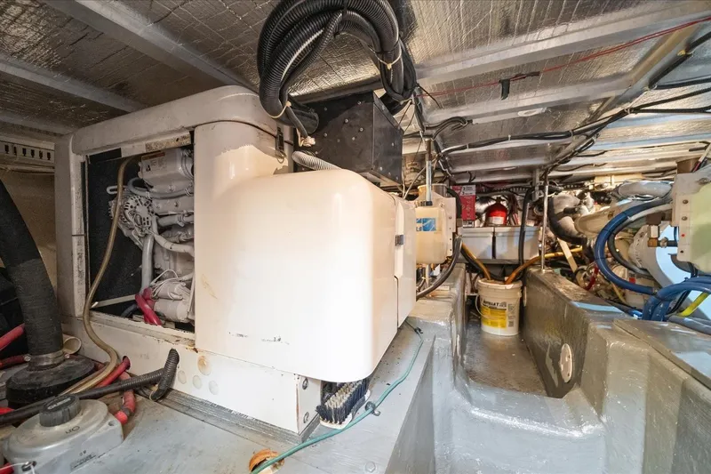 Cape San Blas Inn Yacht Photos Pics Engine room of 1998 Carver 455 Aft Cabin Motor Yacht, showcasing mechanical components.